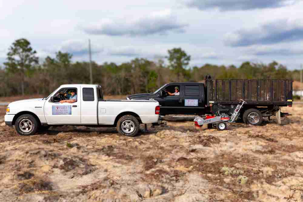 Truck of HG and F-450 with signs and stump grinder